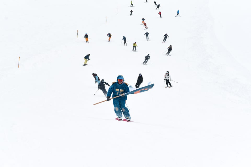 SKInnovation skiers descending the slope together in formation