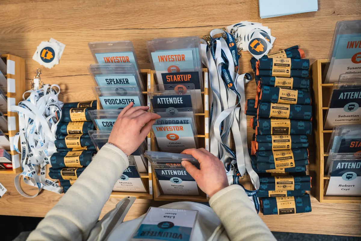 Badges and lanyards prepared at the SKInnovation check-in desk